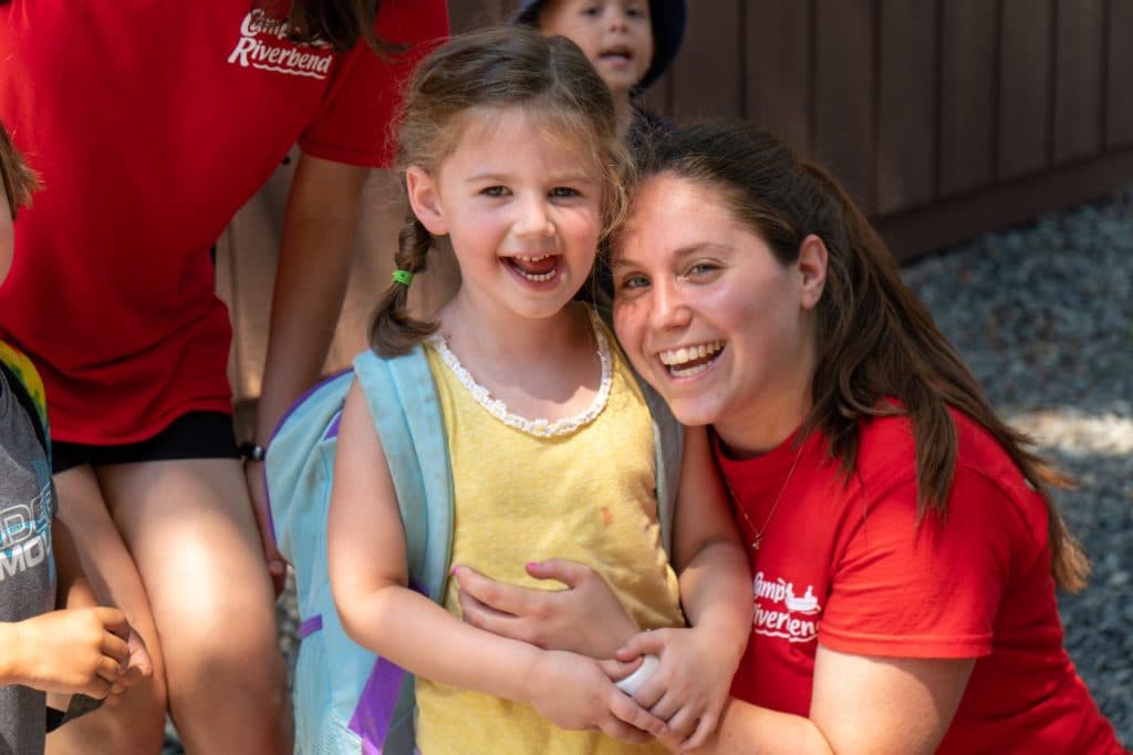 Clubhouse counselors with young campers
